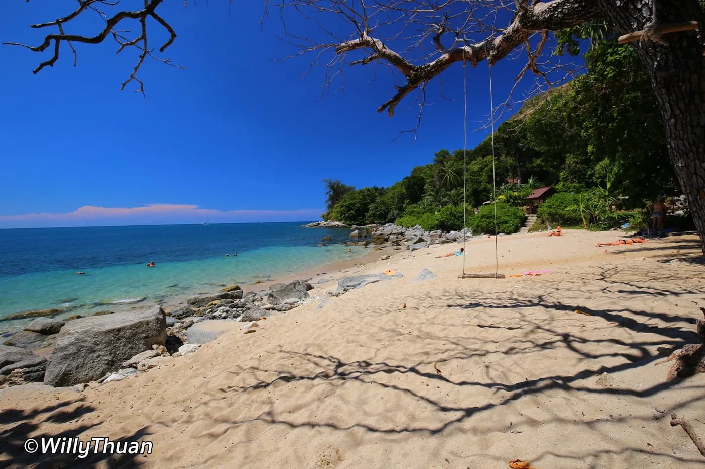 sand, shade trees and the sea