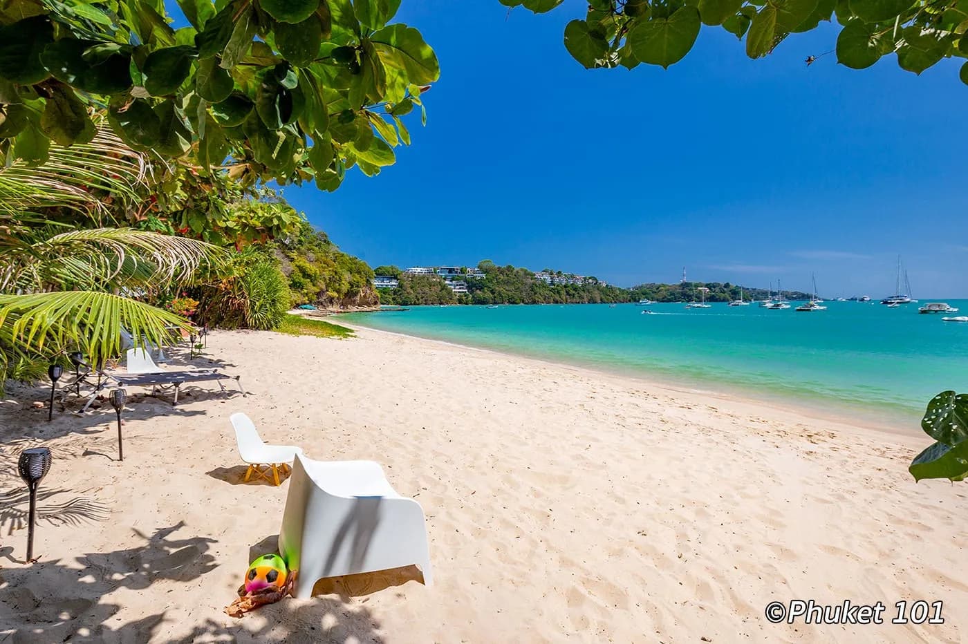 sand, a lounger and the water