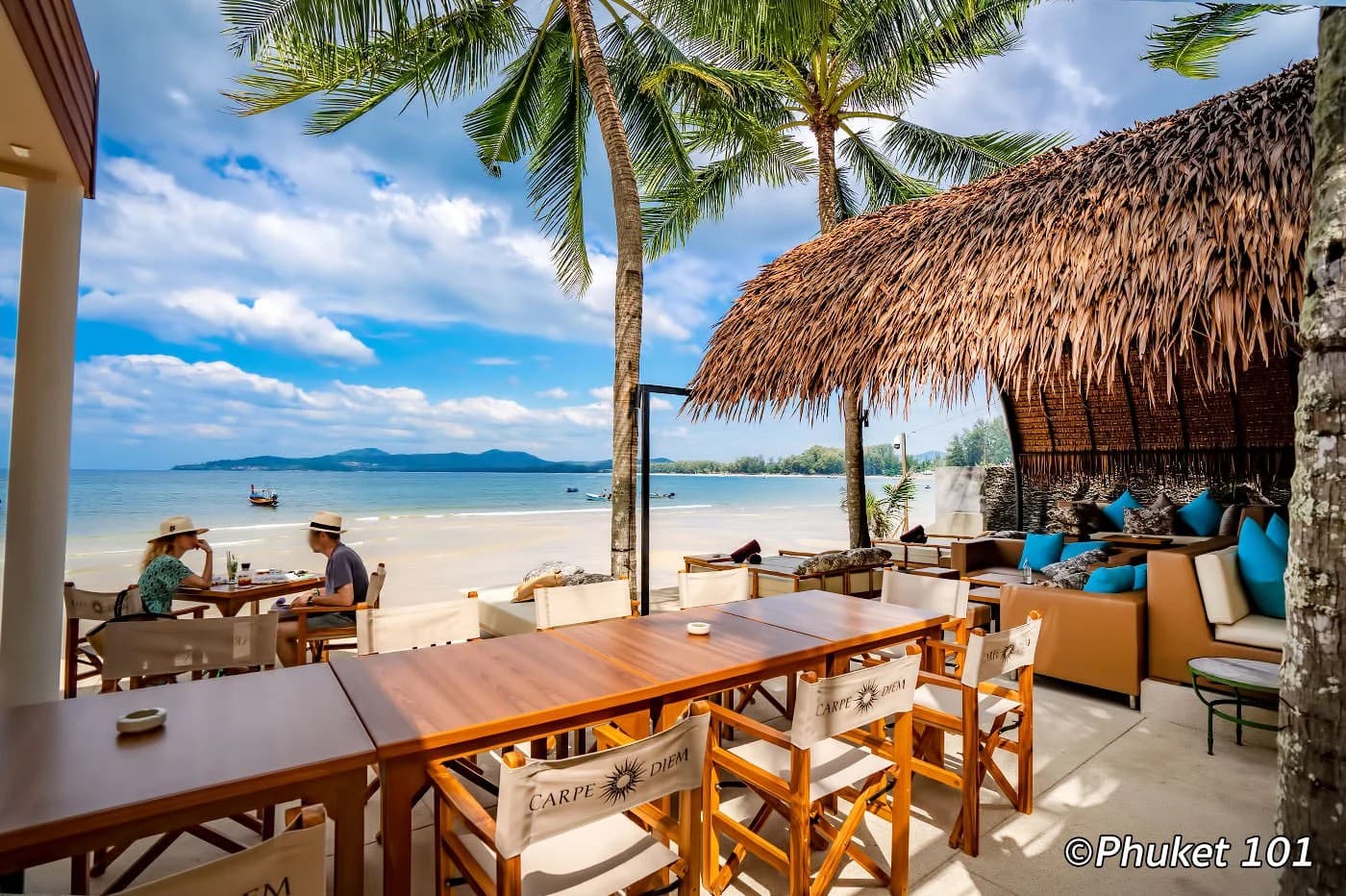 Carpe Diem: tables under a thatched roof, the beach beyond