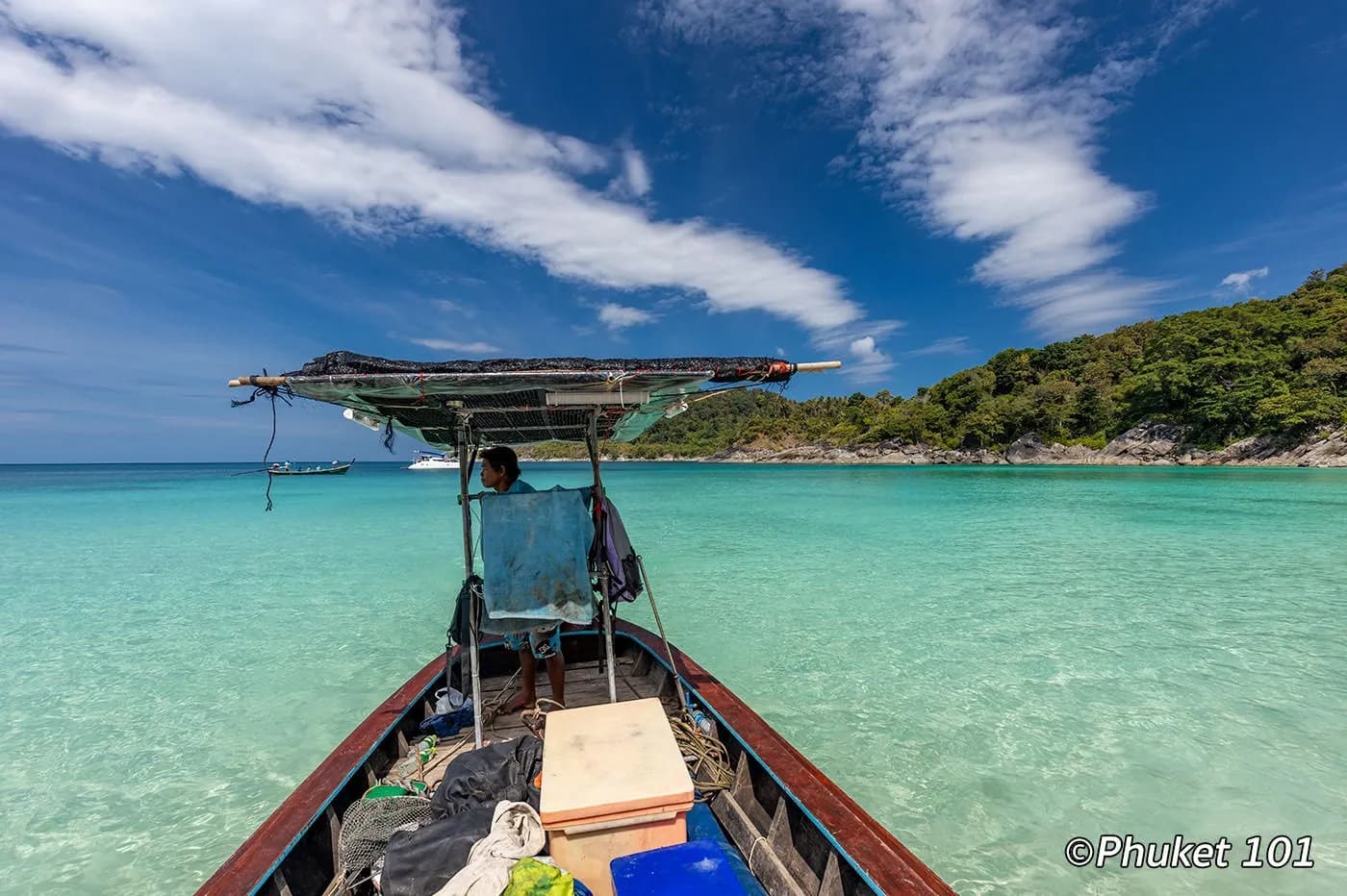 arriving by longtail boat