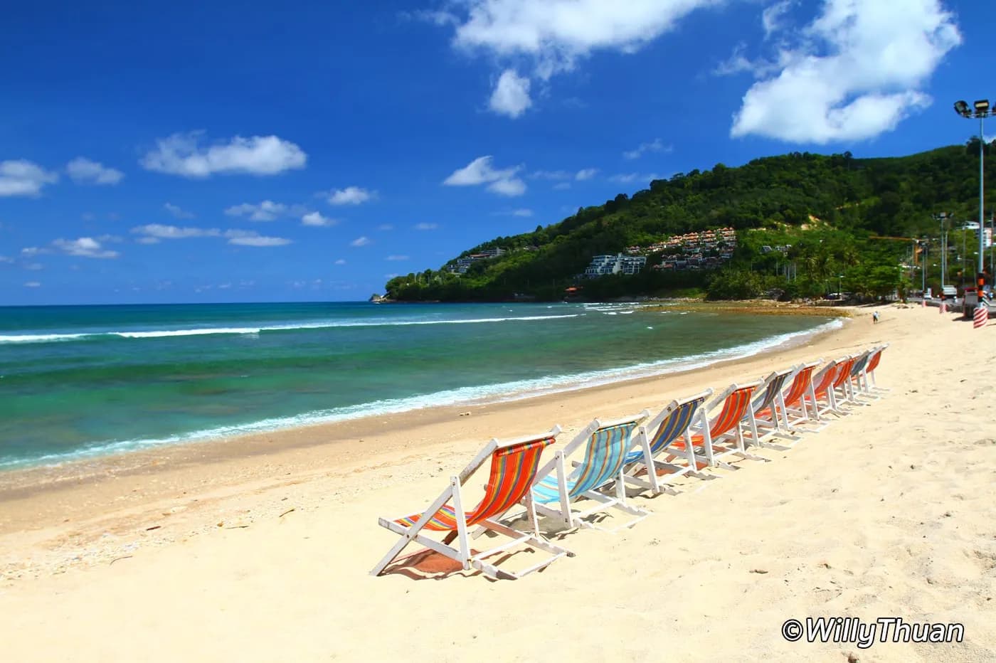 deckchairs on a wide sand beach
