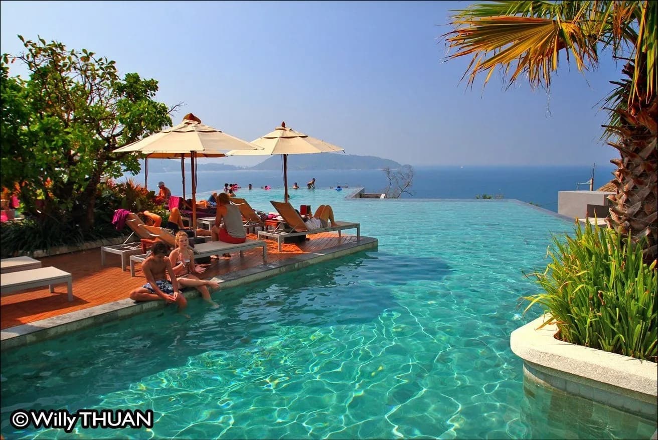 a hillside resort pool above the bay