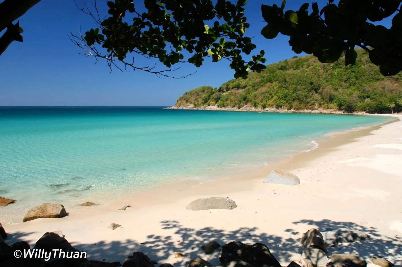 sand, rocks and clear water