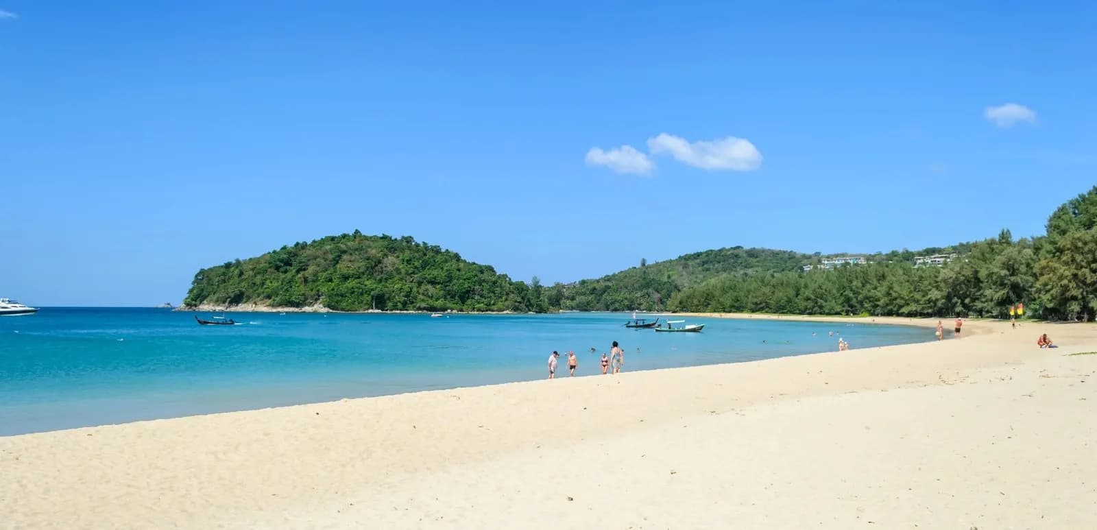 the wide beach and the islet at the north end