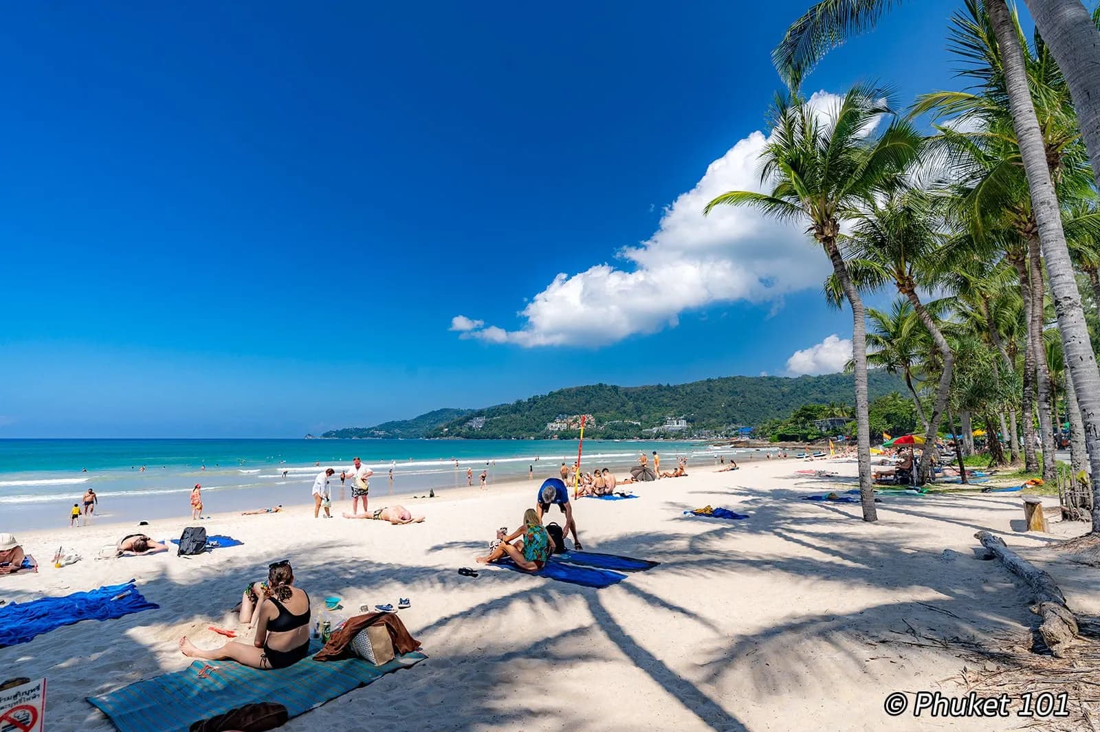 the north end of the beach, sunbeds and the hills