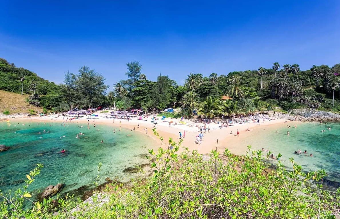 the beach and the clear water from the headland